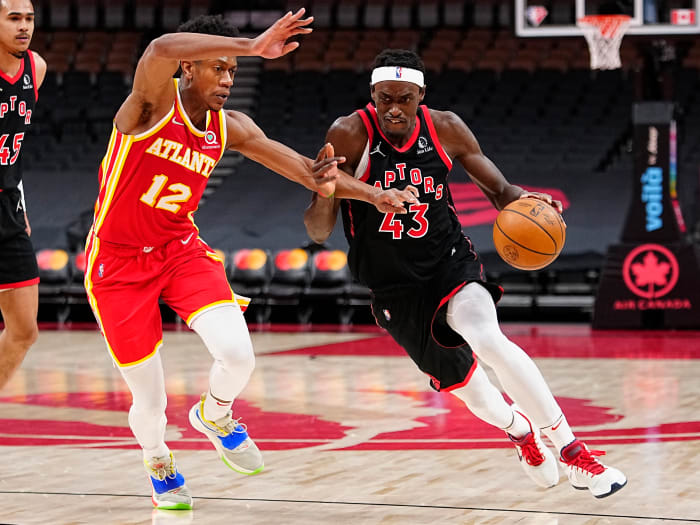 Toronto Raptors forward Pascal Siakam drives to the net against Atlanta Hawks forward De'Andre Hunter. The Hawks and Raptors play each other three times in the 2022-23 NBA season.